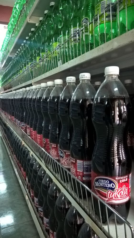 Photo: long line of tuKola bottles in the supermarket shelf